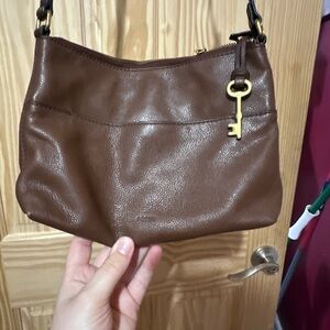 Adorable brown fossil cross body bag.